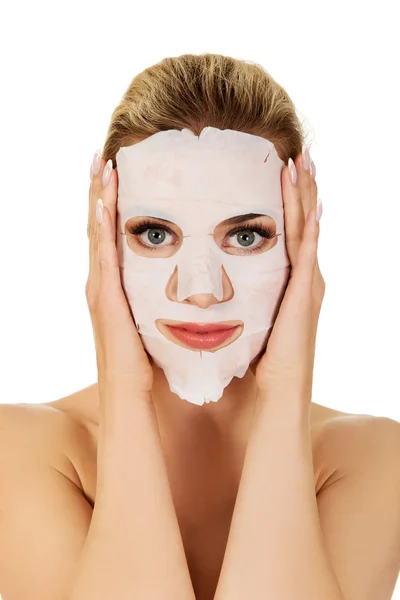 Young woman with facial mask — Stock Photo, Image