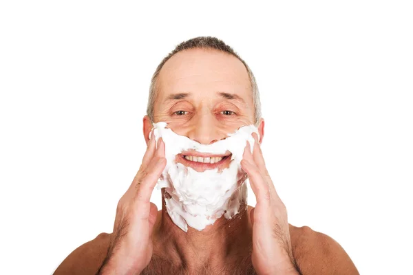 Hombre aplicando espuma de afeitar —  Fotos de Stock