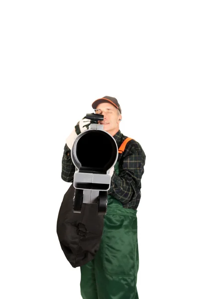 Worker in uniform with a leaf blower — Stock Photo, Image