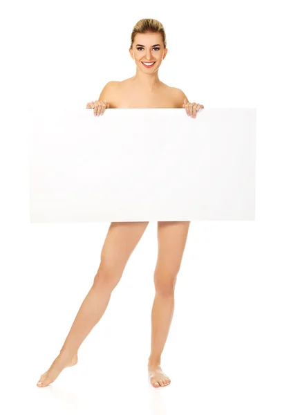 Naked woman holding empty board. — Stock Photo, Image