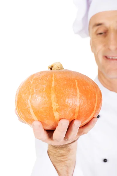 Male chef with a pumpkin — Stock Photo, Image
