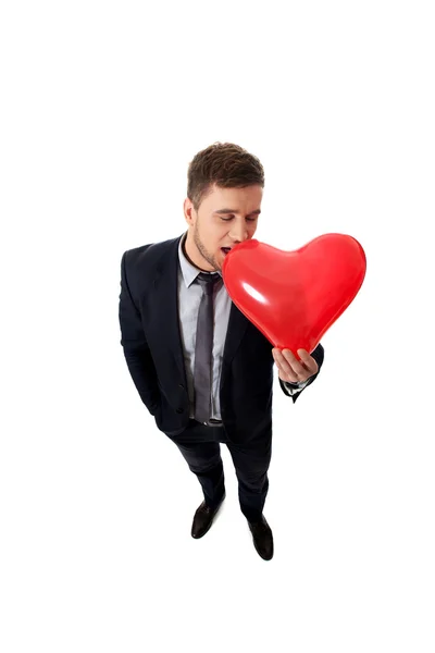 Empresário com balão em forma de coração . — Fotografia de Stock