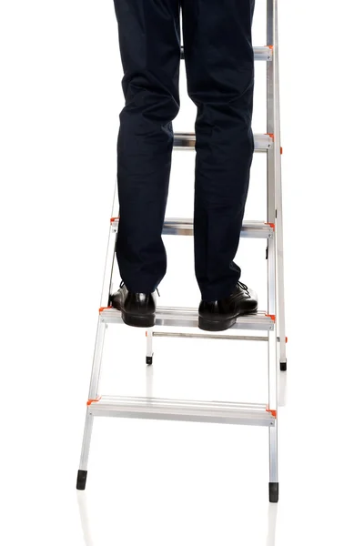 Male legs climbing ladder — Stock Photo, Image