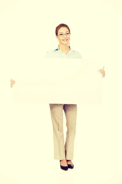 Businesswoman presenting your product. — Stock Photo, Image