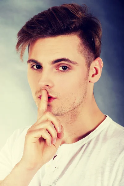 Young man showing silent gesture. — Stock Photo, Image
