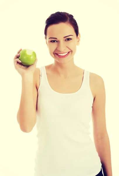 Mulher feliz segurando uma maçã — Fotografia de Stock