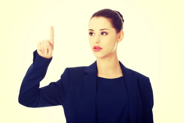 Businesswoman pointing by a finger — Stock Photo, Image