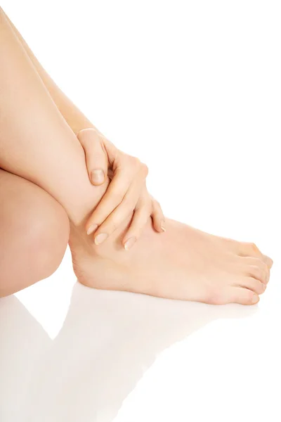 Woman massaging her foot — Stock Photo, Image