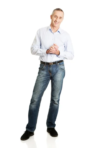 Handsome man with clenched hands — Stock Photo, Image