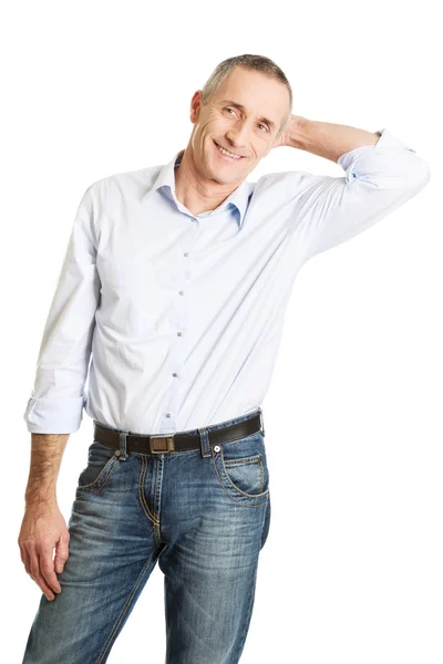 Good looking man touching his head — Stock Photo, Image