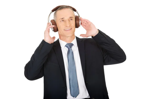 Businessman with big headphones — Stock Photo, Image