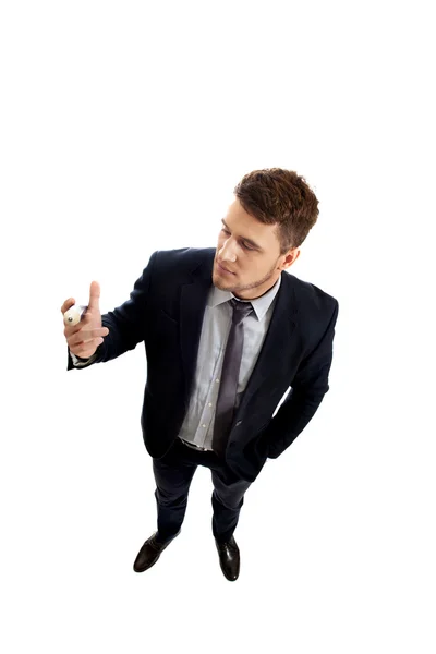 Handsome businessman holding big pencil. — Stock Photo, Image