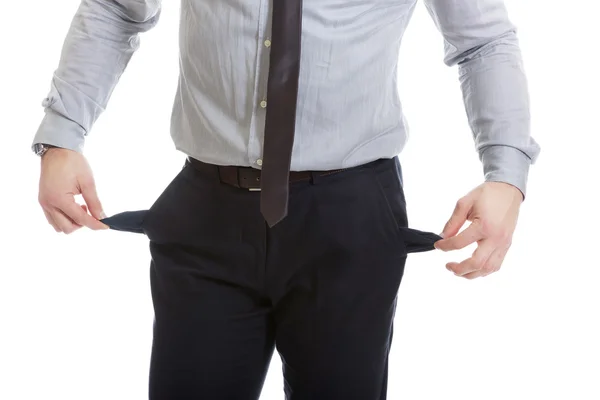 Businessman showing his empty pockets. — Stock Photo, Image