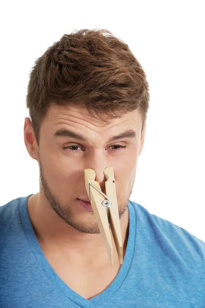 Man with clothespin on his nose. — Stock Photo, Image