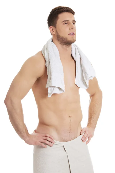 Young athletic man with a towel. — Stock Photo, Image