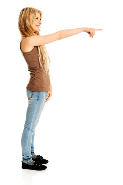 Student woman pointing on the right — Stock Photo, Image