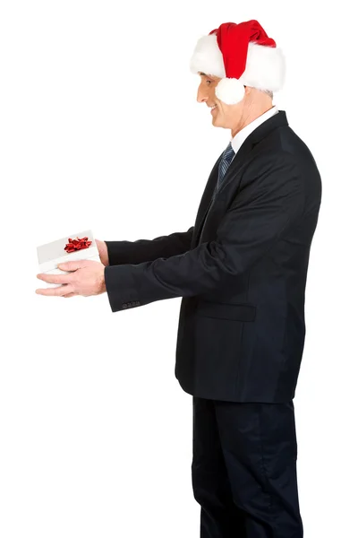 Mature businessman in santa hat — Stock Photo, Image