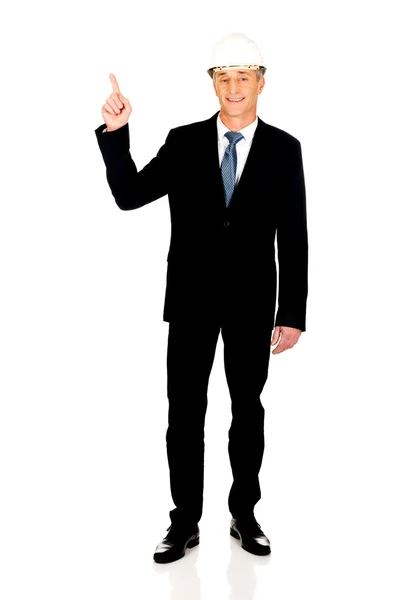 Smiling businessman pointing up — Stock Photo, Image