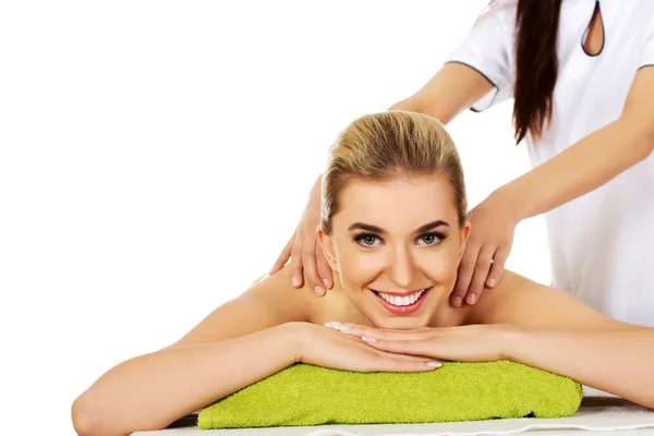 Young smile woman lying on a massage table and has massage. — Stock Photo, Image