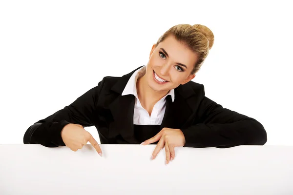 Businesswoman pointing on empty banner — Stock Photo, Image
