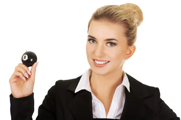 Businesswoman holding billiard ball — Stock Photo, Image