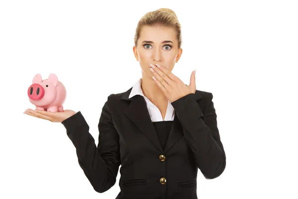 Businesswoman holding piggybank — Stock Photo, Image