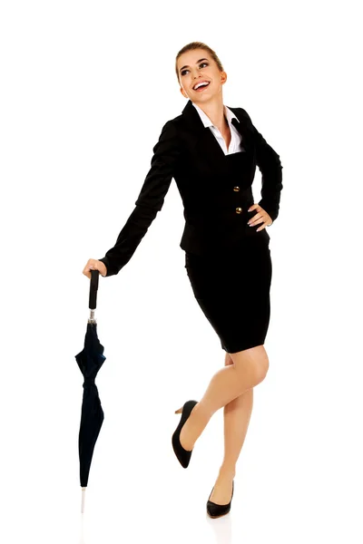 Attractive businesswoman holding an umbrella — Stock Photo, Image