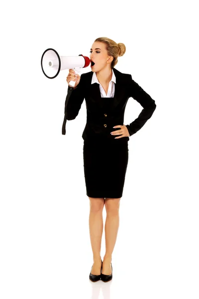Beautiful businesswoman shouting with megaphone Stock Picture