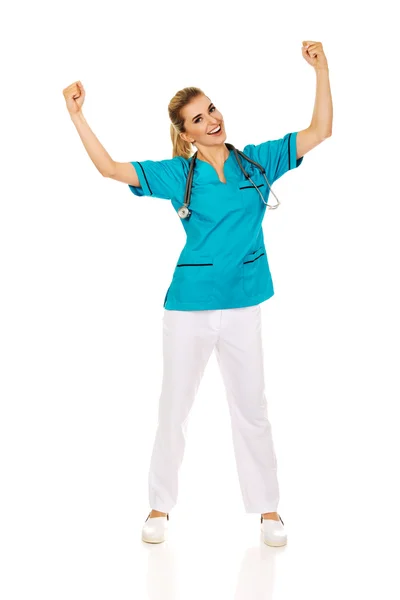 Joven mujer feliz médico con las manos arriba — Foto de Stock