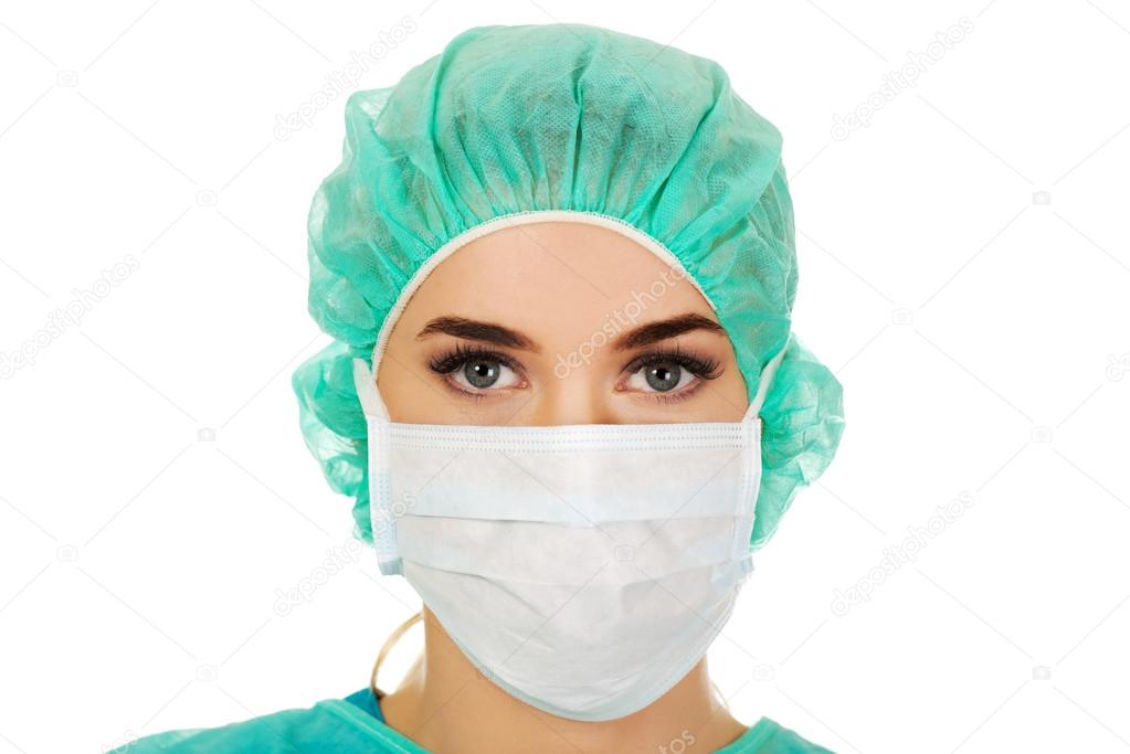 Female surgeon doctor in protective mask