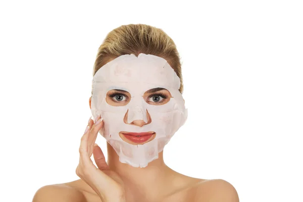 Young happy woman with facial mask. — Stock Photo, Image