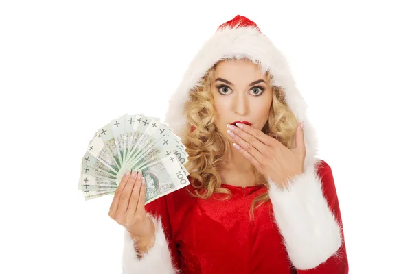 Beautiful santa woman holding a clip of polish money — Stock Photo, Image