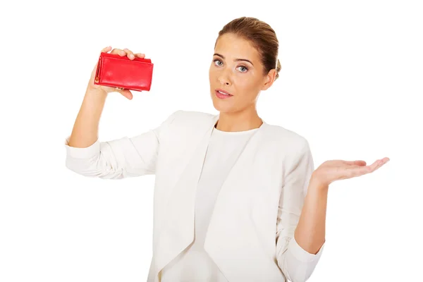 Shocked businesswoman looking into her empty wallet — Stock Photo, Image