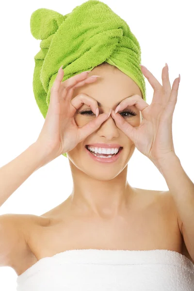 Woman watching through fingers okay glasses. — Stock Photo, Image