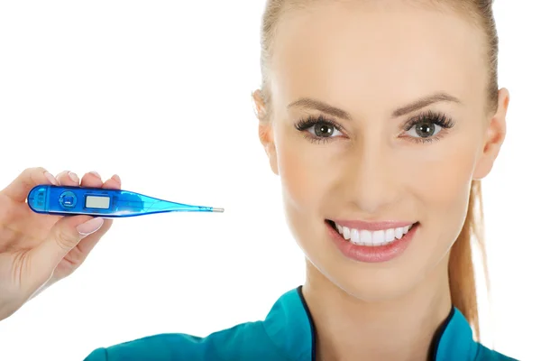 Attractive doctor with a thermometer. — Stock Photo, Image