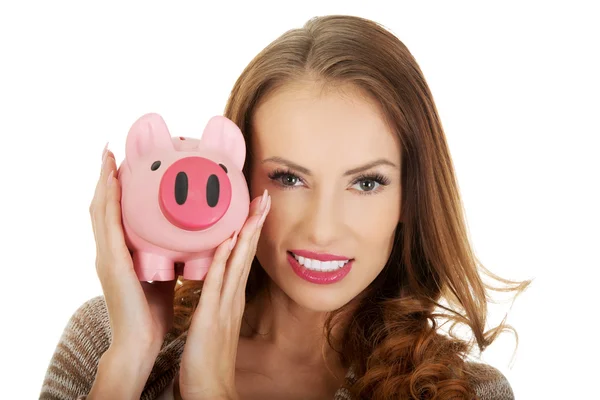 Casual vrouw met piggy-bank. — Stockfoto