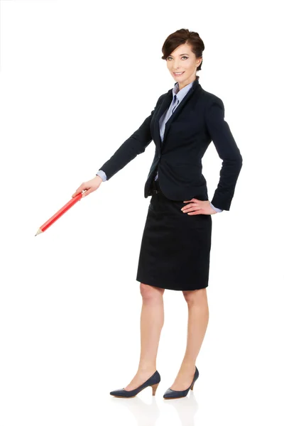 Businesswoman pointing down with pencil. — Stock Photo, Image