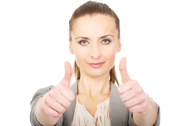 başparmak yukarıya ile gülümseyen iş kadını.