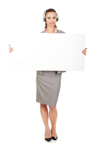Call center woman holding empty banner. — Stock Photo, Image