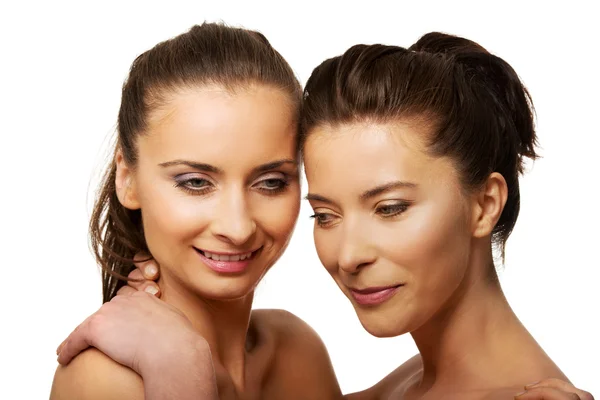 Two sisters with make up embracing. — Stock Photo, Image