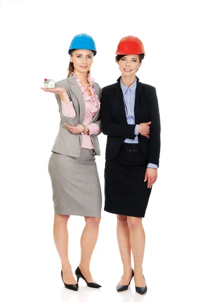 Two architects women with house model. — Stock Photo, Image