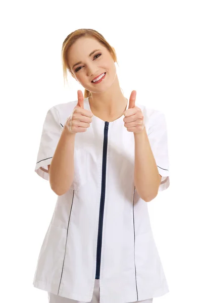 Enfermeira médica mulher com polegares para cima . — Fotografia de Stock