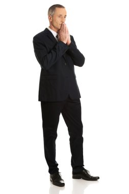 Full length businessman with clenched hands clipart