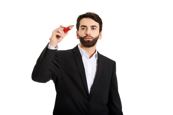 Hombre inteligente escribiendo con lápiz grande . — Foto de Stock