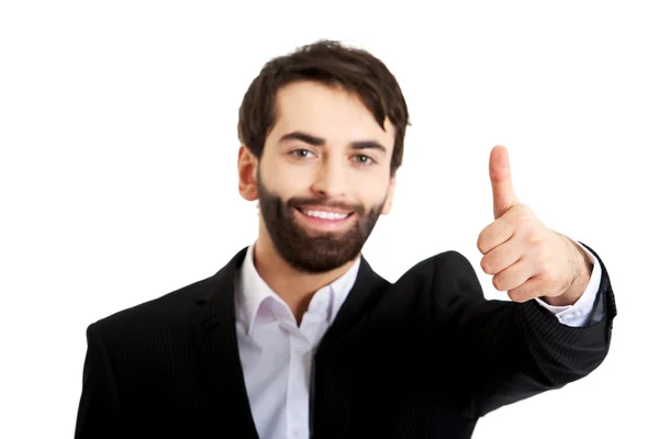 Happy businessman with thumbs up gesture. — Stock Photo, Image