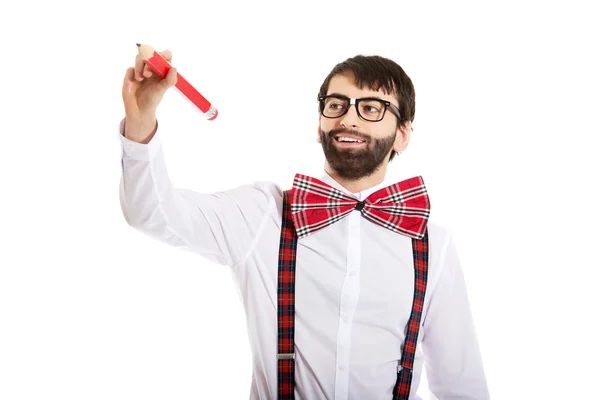 Old fashioned man writing with big pencil. — Stock Photo, Image