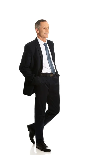 Businessman with hands in pockets — Stock Photo, Image