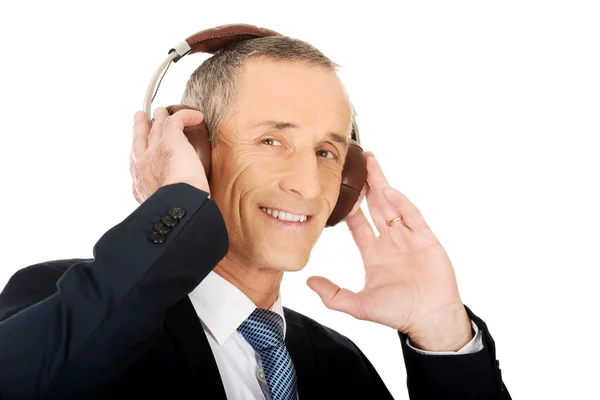 Portrait of businessman with big headphones — Stock Photo, Image