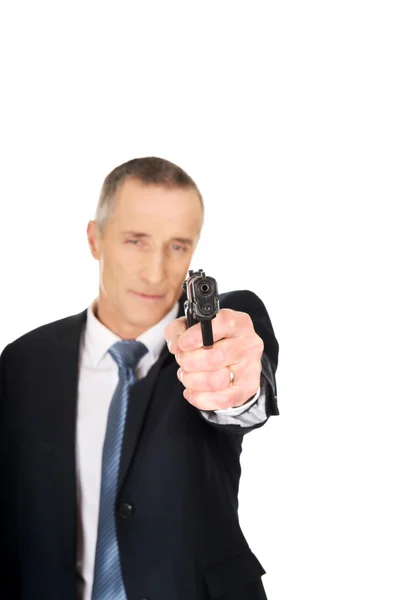 Serious mafia agent aiming by handgun — Stock Photo, Image