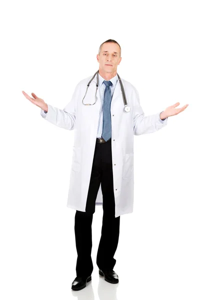 Mature male doctor holding copyspace — Stock Photo, Image